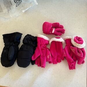 Three sets of gloves and ones pair of waterproof mittens for children